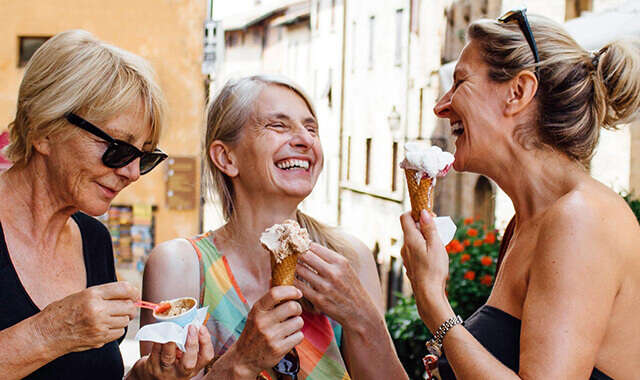three women enjoying icecream wearing dentures 