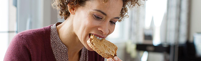 woman eating toast