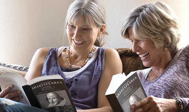 Two women reading books together
